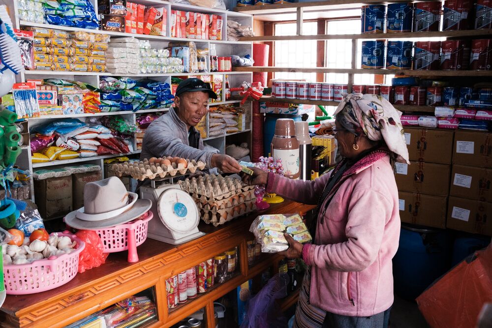 a man selling goods in a local shop